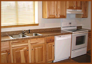 Enjoy all your favorite meals and snacks while on vacation in eagle Nest, New Mexico, this fully equipped kitchen has a full size oven and dishwasher, coffee maker, microwave, double sink and granite countertops.
