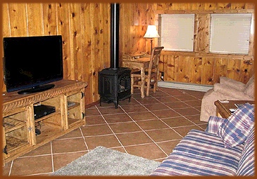 This Eagle Nest, New Mexico vacation rental guest house has all the comforts of home, with comfortable recliner for reading or TV viewing, and a writing desk.